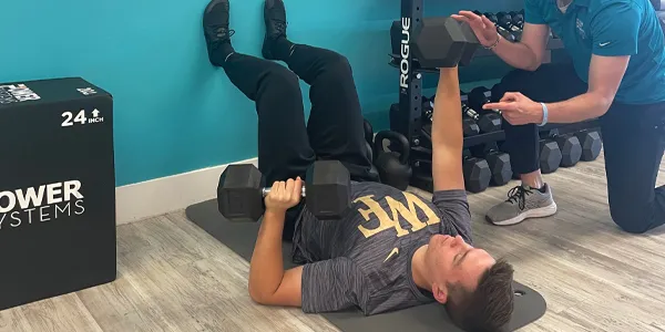 Demonstration of how to do an Alternating Dumbell Press